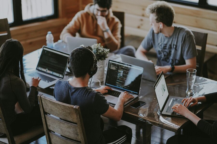 Cross-functional team collaborating around a table